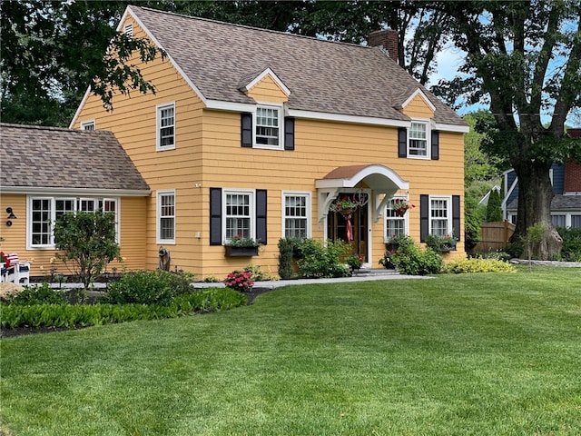 colonial home with a front yard