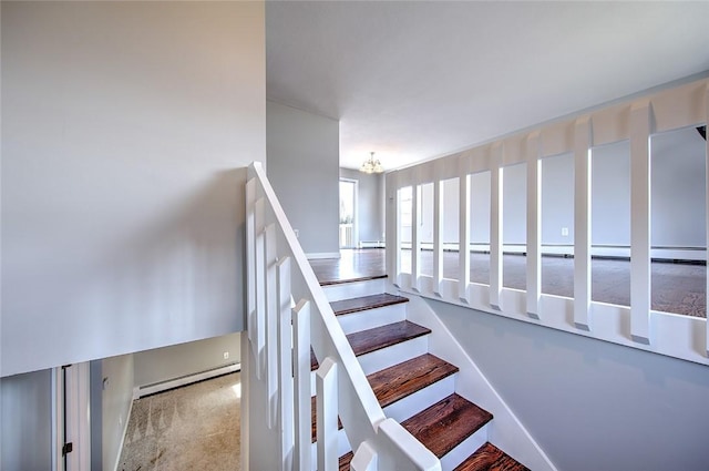 stairs featuring an inviting chandelier and carpet