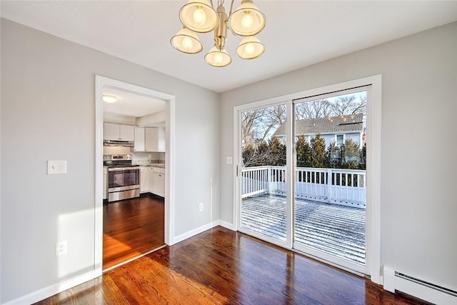 unfurnished dining area with baseboard heating, a notable chandelier, and dark hardwood / wood-style floors