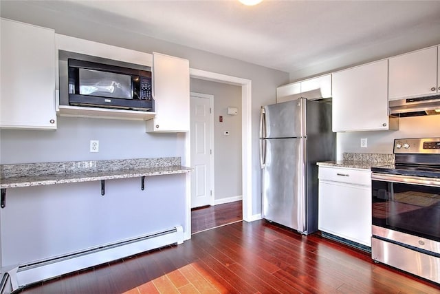 kitchen featuring stainless steel appliances, white cabinetry, light stone counters, a baseboard heating unit, and ventilation hood