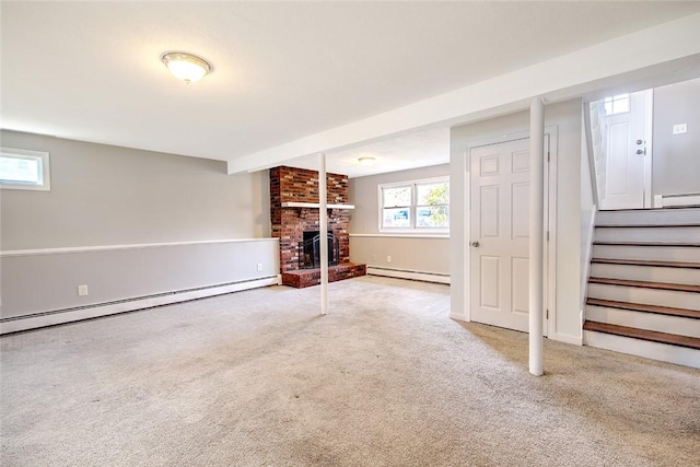 basement featuring a fireplace, carpet floors, and a baseboard radiator