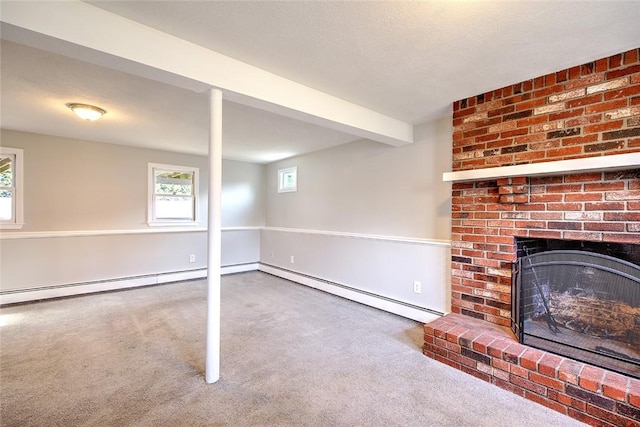 interior space with a baseboard radiator, a fireplace, carpet, and beam ceiling