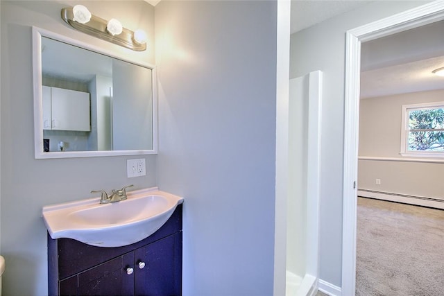 bathroom featuring vanity and a baseboard radiator