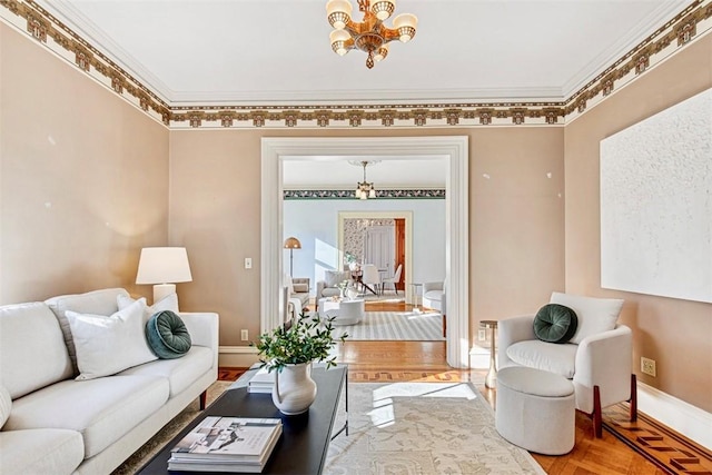 living room with a chandelier, parquet flooring, and ornamental molding