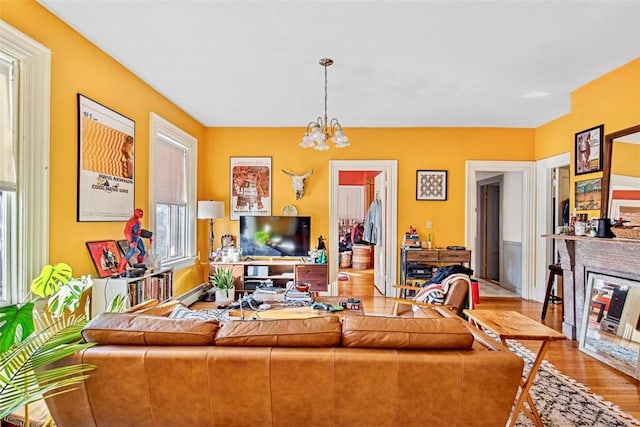 living room featuring hardwood / wood-style floors and a notable chandelier