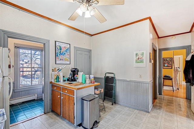 office area with a baseboard heating unit, ceiling fan, and crown molding