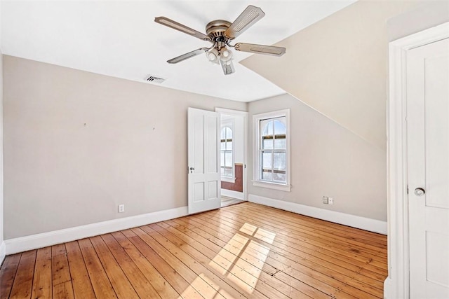 bonus room with vaulted ceiling, light wood-type flooring, and ceiling fan