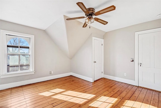 bonus room with ceiling fan, light hardwood / wood-style flooring, and lofted ceiling