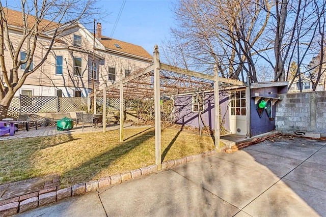 exterior space with a patio area and a yard