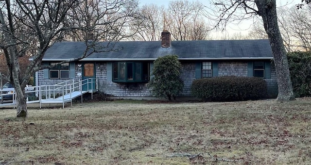 ranch-style home with a front yard