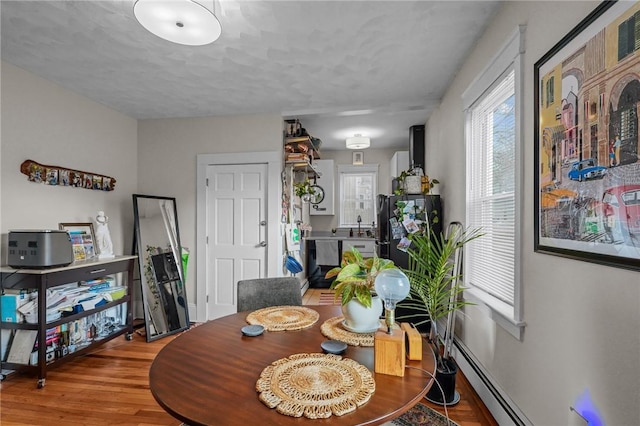 dining area with wood-type flooring