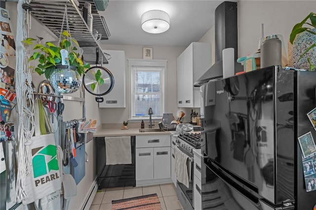 kitchen featuring black fridge, light tile patterned floors, dishwashing machine, white cabinets, and stainless steel range with gas stovetop