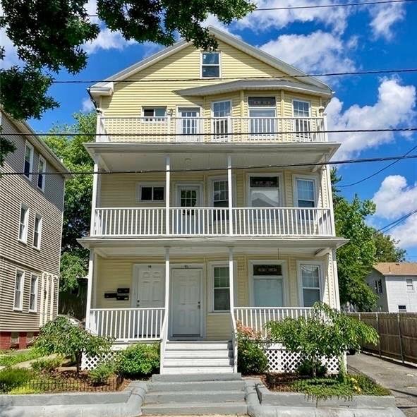 view of front of property featuring a balcony and covered porch