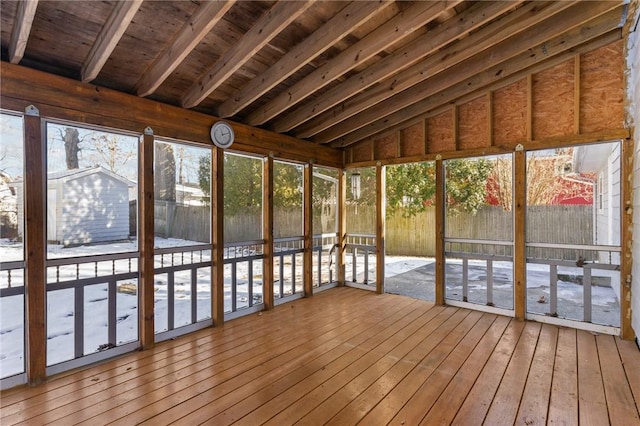 unfurnished sunroom with vaulted ceiling and wooden ceiling