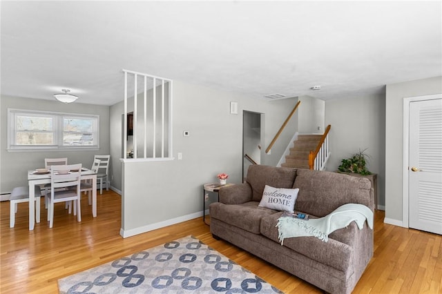 living room with light hardwood / wood-style flooring