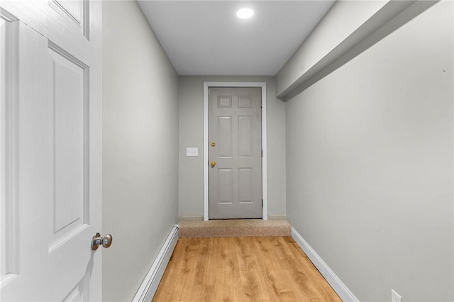 entryway featuring baseboard heating and light hardwood / wood-style flooring