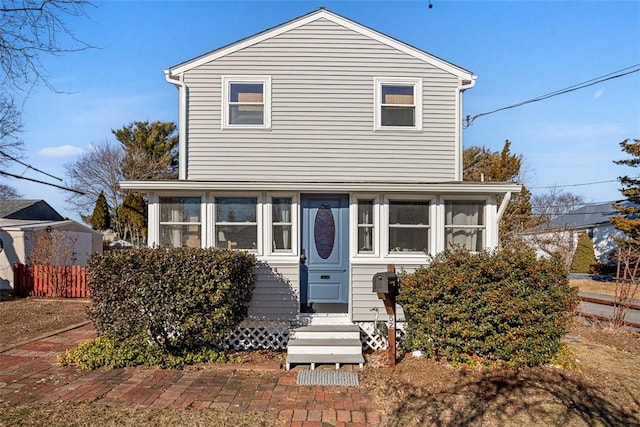 view of front facade featuring a sunroom