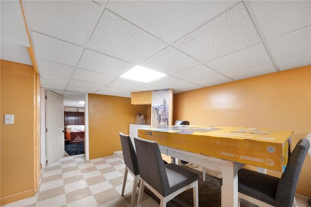 dining room with a paneled ceiling