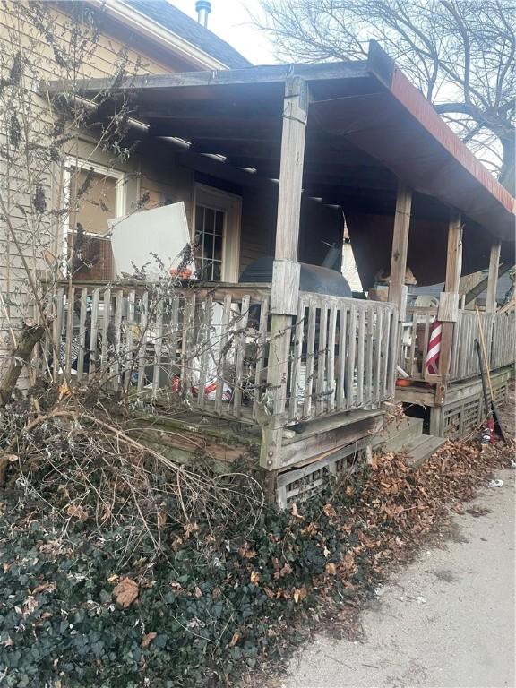 view of property exterior featuring a porch