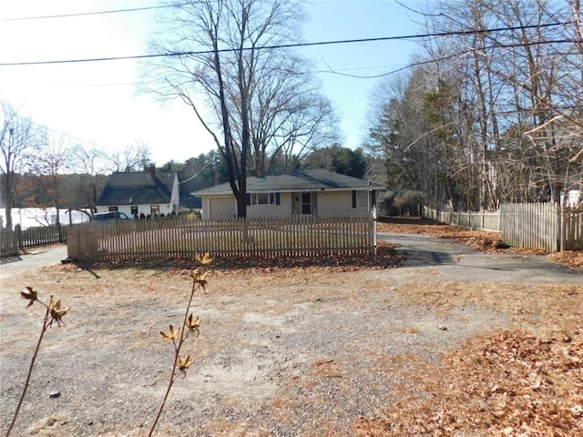 view of front of house with a water view