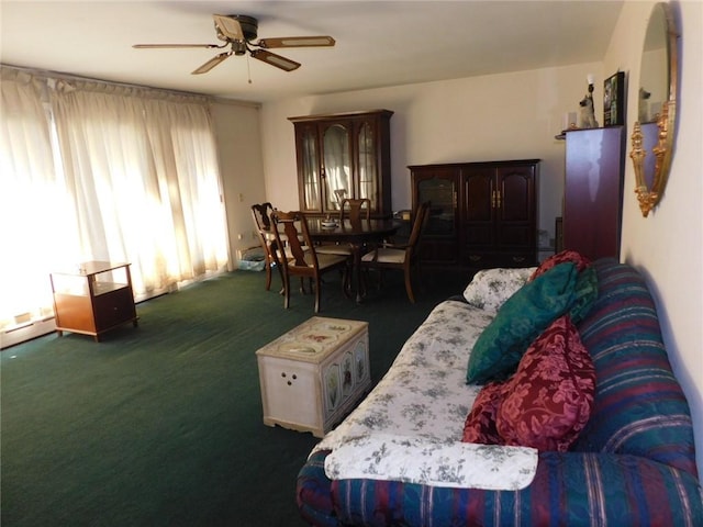 carpeted living room featuring ceiling fan and a healthy amount of sunlight