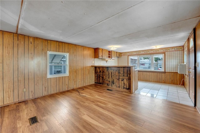 unfurnished living room with light hardwood / wood-style floors