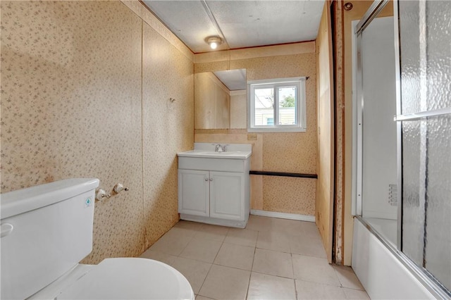 full bathroom featuring enclosed tub / shower combo, tile patterned flooring, vanity, and toilet