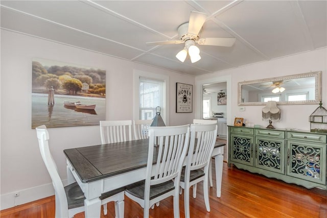 dining room with ceiling fan and hardwood / wood-style flooring