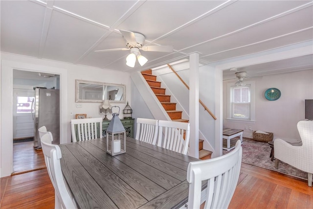 dining area featuring light wood-type flooring and ceiling fan