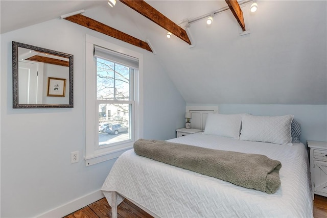 bedroom with hardwood / wood-style floors and lofted ceiling with beams