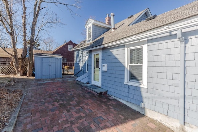 exterior space with a patio area and a storage unit