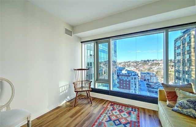 sitting room with hardwood / wood-style floors