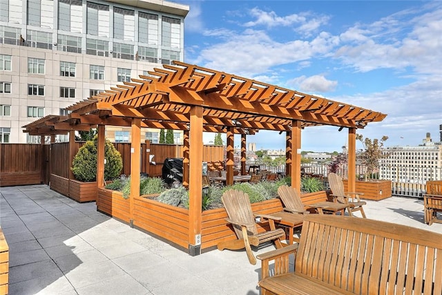 deck with a patio area and a pergola