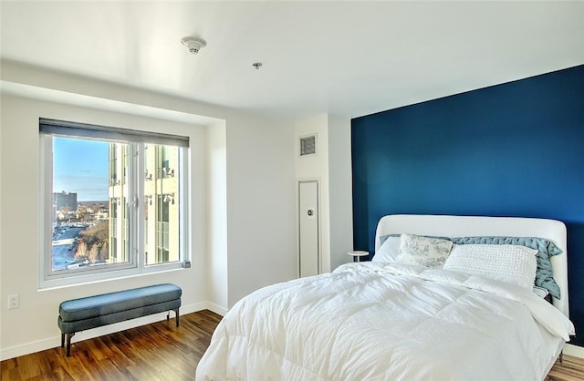 bedroom featuring dark wood-type flooring