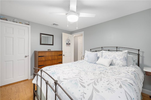 bedroom with ceiling fan and light wood-type flooring