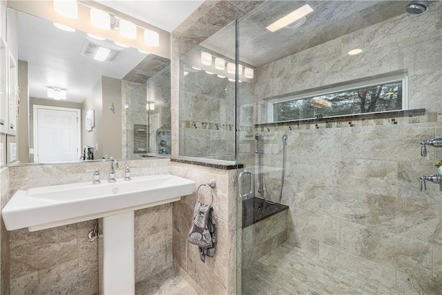 bathroom featuring an enclosed shower