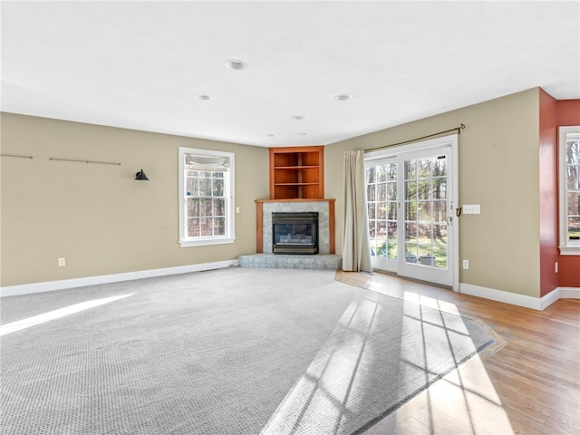 unfurnished living room featuring light hardwood / wood-style flooring