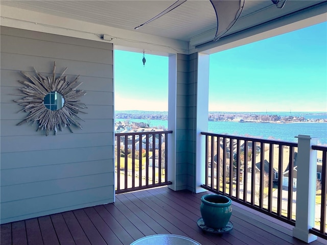 wooden terrace with a water view