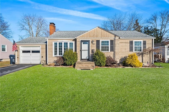 ranch-style home with a front lawn and a garage