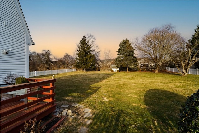 view of yard at dusk