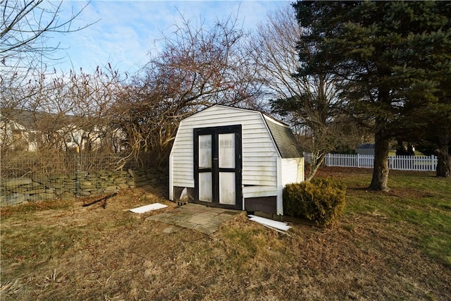 view of outbuilding featuring a lawn