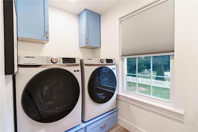 laundry room with cabinets and independent washer and dryer