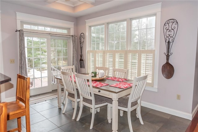 dining area with dark tile patterned flooring