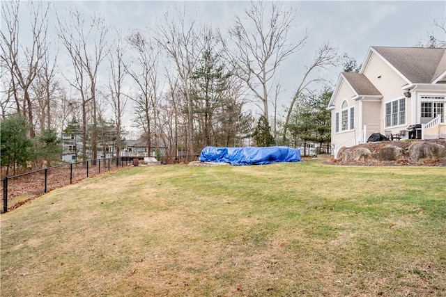 view of yard with a covered pool