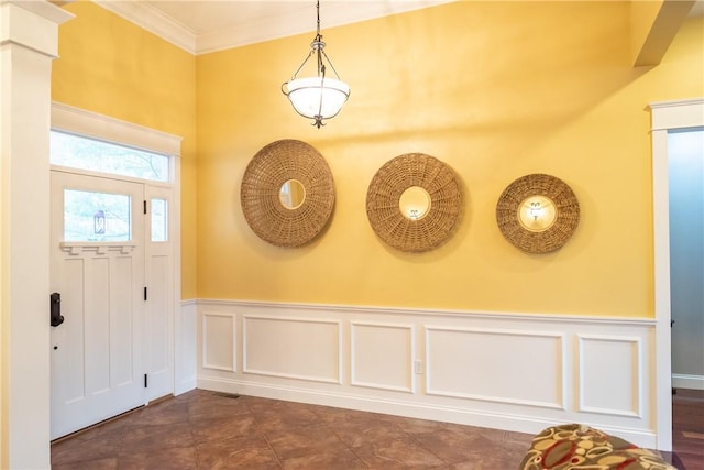 foyer featuring crown molding