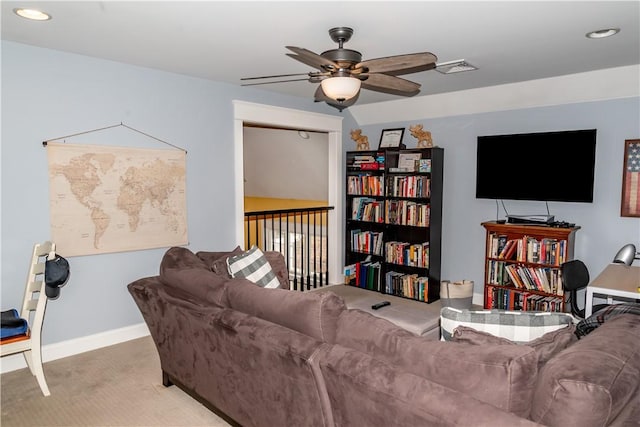 living room featuring carpet flooring and ceiling fan