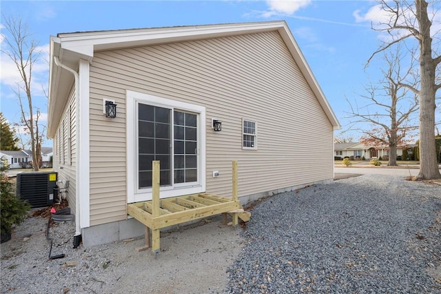 view of side of property featuring central air condition unit