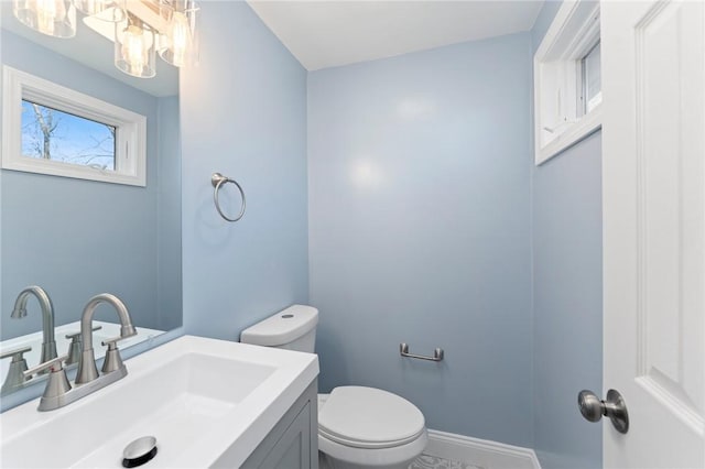 bathroom with toilet and vanity