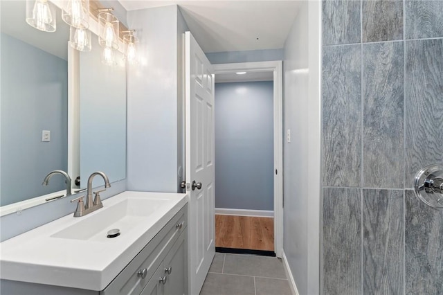 bathroom featuring tile patterned flooring and vanity