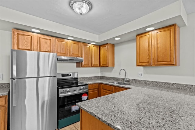 kitchen featuring light tile patterned floors, appliances with stainless steel finishes, light stone counters, and sink